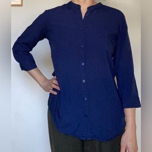 Navy blue collarless button-up. 3/4 sleeve. Uniqlo Women’s Size S. 100% Rayon.